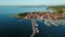 4K. Flight over old town Izola in Slovenia, aerial panoramic view with marina at sunset. Adriatic sea coast. Peninsula of Istria