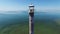 4K. Flight and takeoff over old lighthouse standing in the sea, aerial view. Estonia, Saaremaa island - Kiipsaare tuletorn