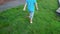 4k footage of barefoot toddler boy running on fresh green grass at park