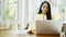 4K footage. business woman typing on a laptop keyboard at coffee shop