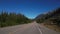 4K footage of driving on a road with the Canadian Rockies in the background
