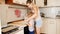 4k footage of little toddler boy helping his mother cutting pie dough on kitchen with special round cutter