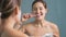 4K footage of sleepy woman brushing teeth at morning and being late for work