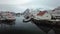 4k footage in the Svolvaer rorbuer with fishing boats at the polar circle  village in Lofoten , Henningsvaer