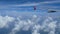 4K footage. traveling by air. view through an airplane window. wing airplane and cloud on sky