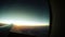 4k Footage view from aeroplane: sun is rising above the fluffy clouds