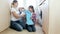 4k footage of young mother with teenage girl loading washing machine with dirty clothes at laundry