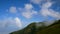 4K. great view of foggy mountains at national park in the mist with blue sky and white cloud running with speed up.