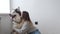 4k. Happy woman pet, embracing alaskan malamute dog sitting together