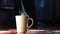 4k Hot smoke over home brew espresso coffee cup on the dark background by the morning light