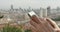 4k human using a smartphone aganist modern urban building background.