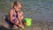 4K Kid Playing in Sand on Beach, Child Plays in Waves on Seashore, Girl Building Castle Bay on Coastline