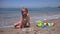 4K Kid Playing in Sand on Beach, Child Plays in Waves on Seashore, Girl Building Castles Bay on Coastline