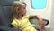 4K Kid Travelling by Plane, Child in Airplane, Pensive Thinking in Vacation