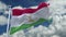 4k looping flag of Tajikistan waving in wind,timelapse rolling clouds background.