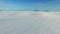 4K. Low flight and takeoff above snow fields in winter, aerial view (Snow desert)