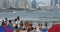 4k many people at crowded sandy beach.People swimming in sea,QingDao,China.