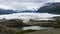 4K moving time lapse clip of Matanuska Glacier Alaska Chugach Mountains with clouds and pond