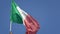 4K. National flag of Italy floating in wind on a blue sky. Italian flag