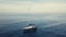 4k orbit aerial of sailing boat in sunset cloudscape