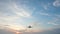 4K Overhead flying aircraft landing at sunset or sunrise