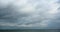4k Panoramic of dark altocumulus clouds flying in cloudy sky.sea ocean water.