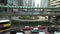 4K People walking suspended footbridge crossroad traffic street in Hong Kong