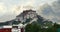 4k Potala Palace in the morning,mountains surrounded by clouds.