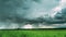 4K Rain Rainy Clouds Above Countryside Rural Field Landscape With Young Green Wheat Sprouts In Spring Summer Cloudy Day