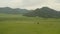 4K resolution, aerial drone at 29 frames per second over mountain in National Park with cloudy skies. Altai. Russia.