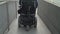 4k resolution back view of a man on electric wheelchair using a ramp. Accessibility concept