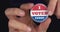 4k resolution closeup video of a hand holding I voted today button. Elections concept