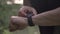 4k resolution closeup video of sports man making various gestures with a finger on a touch screen of a smart watch
