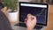 4k resolution of a man`s hand holding bitcoin coin and checking cryptocurrency chart