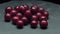 4K. Ripe fresh Cherry on a dark concrete table rotation on black background.