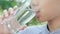 4k Selective focus, close up young Asian boy drink water