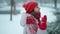 4k slow motion camera circling around young pretty smiling happy woman in red mittens and hat wearing parka standing in