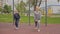 4K slow motion Mother and daughter doing exercises on open air sport playground. Sportive family