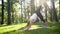 4k slow motion video of yoga and fitness on grass at park. Middle aged smiling woman practicing and doing exercises on