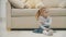4k slowmotion video of little blond girl sitting on the floor saying no.