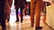 4K steadicam walk though shot of customers` feet at Christmas bazar in typical modern shopping mall