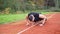 4k still video of young fit man doing push ups in the morning outdoor on the running race track