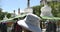 4k tibet people turn spinning buddhist prayer wheels,Potala & white stupa.