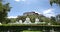 4k tibet people turn spinning buddhist prayer wheels,Potala & white stupa.