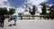 4k tibet people turn spinning buddhist prayer wheels,Potala & white stupa.