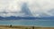 4k Tibetans walking the pilgrim at the lake namtso in tibet,snow mountain.