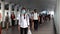 4K Time lapse of asian office worker wear face mask walking in pedestrian walkway