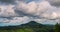 4K Time Lapse  blue sky white cloud bright, clear cloudy scenery green mountain nature on sunny day. Beautiful landscape timelapse
