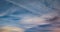 4k Time lapse clip of evening fluffy curly rolling altostratus clouds in windy weather