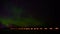 4K timelapse of aurora borealis in northern Sweden with dancing green and purple light beside a lake